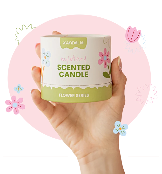 Hand holding Kandelia mystery scented candle from the Flower Series